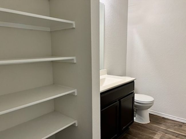 Bathroom featuring vanity and wood finished floors | Image 16