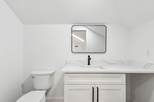 Bonus living area room with half bath. | Image 33