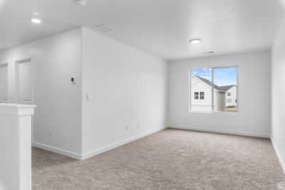 Spare room with light carpet | Image 2