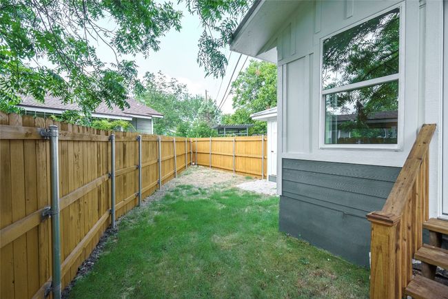 View of fenced backyard | Image 33