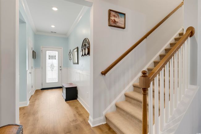 Foyer entrance with crown molding and light hardwood / wood-style flooring | Image 10