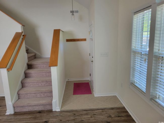 Staircase with plenty of natural light and wood finished floors | Image 9