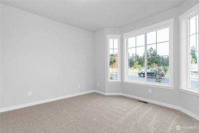 Charming details throughout include a bay window in the front bedroom. | Image 3