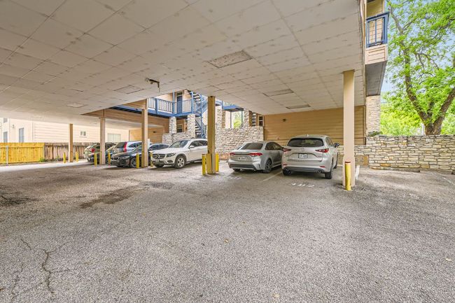 Covered parking lot with fence | Image 27
