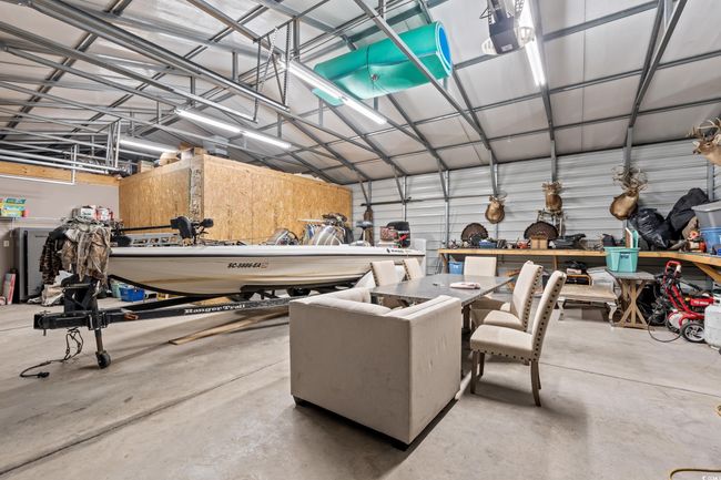Garage with a garage door opener | Image 30