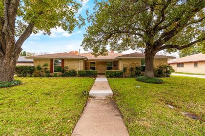 Ranch-style full duplex featuring a front lawn | Image 2