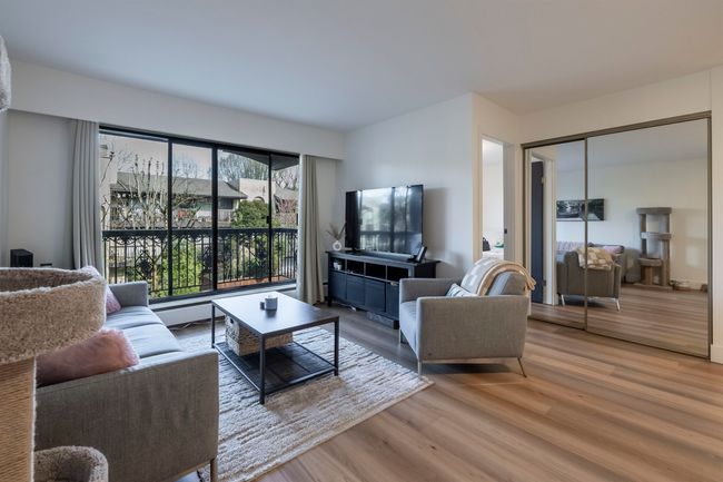 Living area featuring light wood-type flooring | Image 8