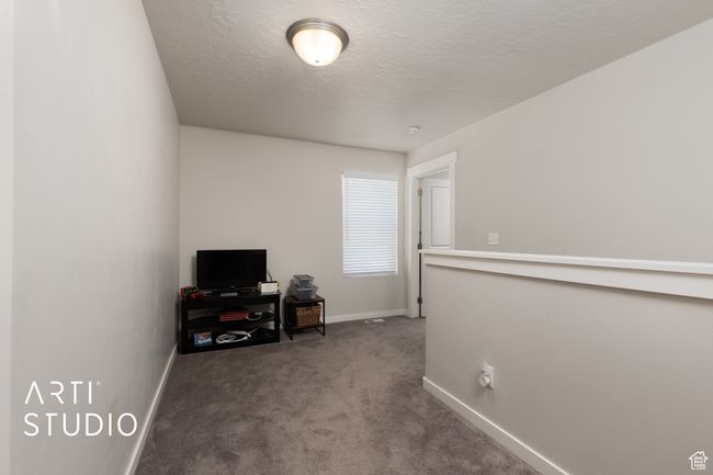 Home office featuring carpet, baseboards, and a textured ceiling | Image 21