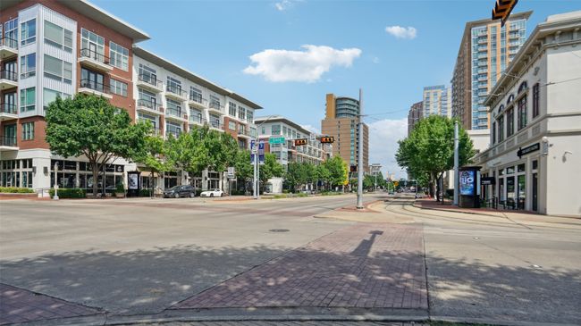 View of street with sidewalks, curbs, and street lights | Image 27