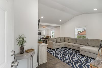 Notice the vaulted ceiling in the living room making it feel spacious | Image 3