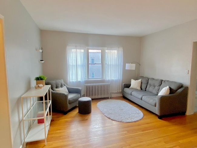 Picture yourself getting comfy in this warm, bright living space... | Image 7