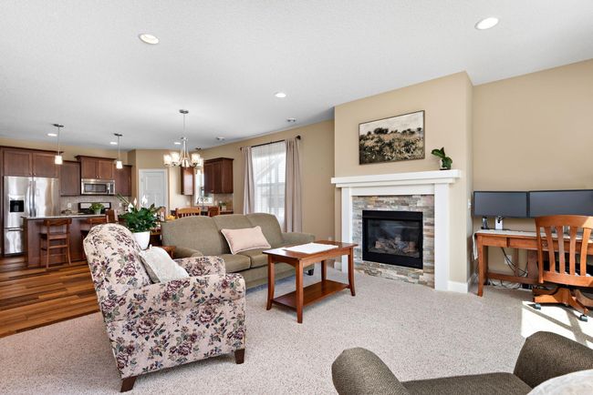 Living Room has beautiful gas fireplace and surround - Open to Dining Room, Kitchen and Sun Room! | Image 9