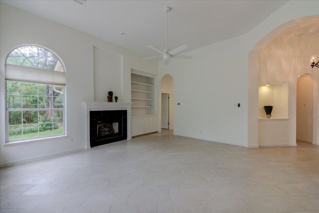 New floor tile, fresh paint and new fireplace surround. | Image 6