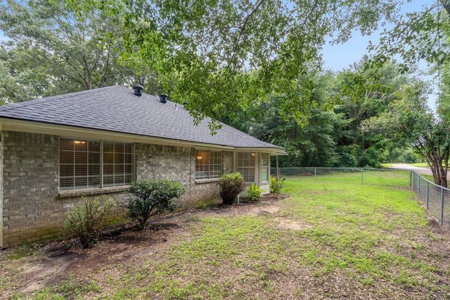 View of fenced backyard | Image 27