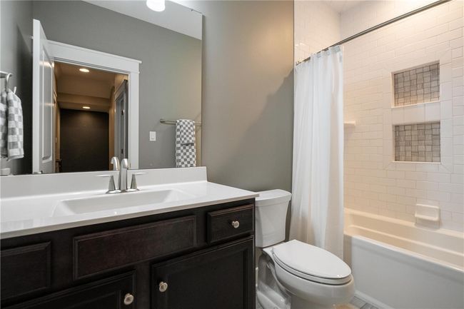 Hall Bath on second floor has a tub/shower with ceramic surround and floor. | Image 29