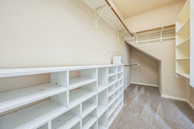 Walk in closet featuring carpet flooring | Image 11