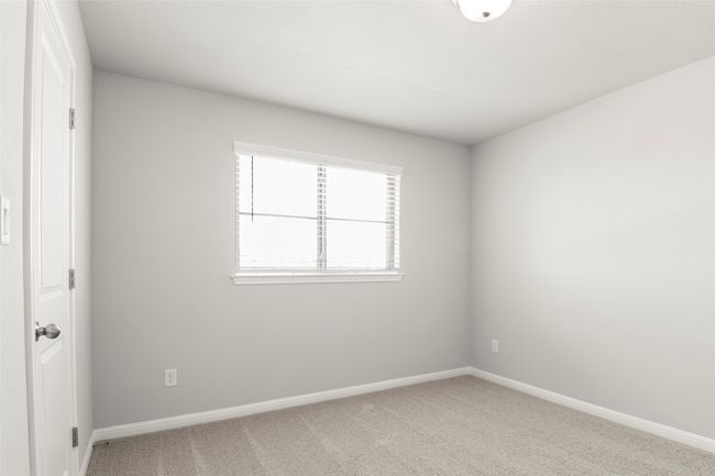 Empty room featuring light colored carpet and baseboards | Image 27