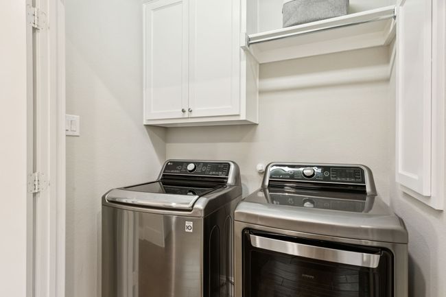 Laundry area with cabinet space and washing machine and clothes dryer | Image 19