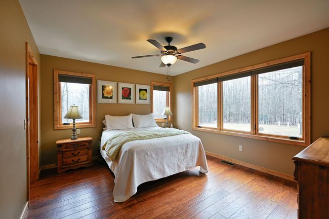 This home has true one-level living with a main floor primary bedroom. To the left is a walk-in closet. | Image 38