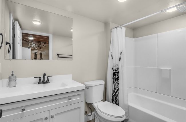 Full bathroom featuring vanity, toilet, and shower / tub combo with curtain | Image 23