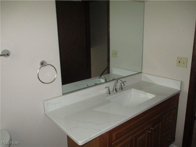 Bathroom with toilet and vanity | Image 9