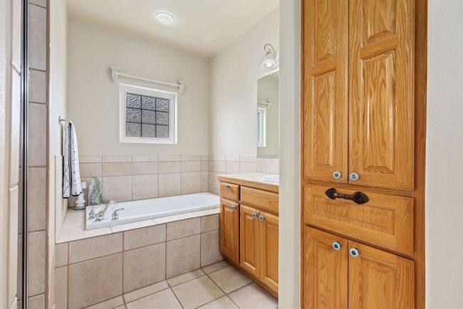 Built-ins and soaking tub, separate shower is walk-in. | Image 18