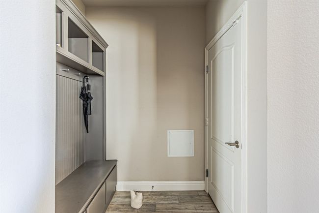 Mudroom featuring wood finished floors and baseboards | Image 8