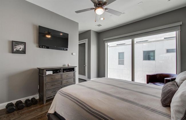 Primary bedroom with floor to ceiling windows and your very own balony. | Image 26
