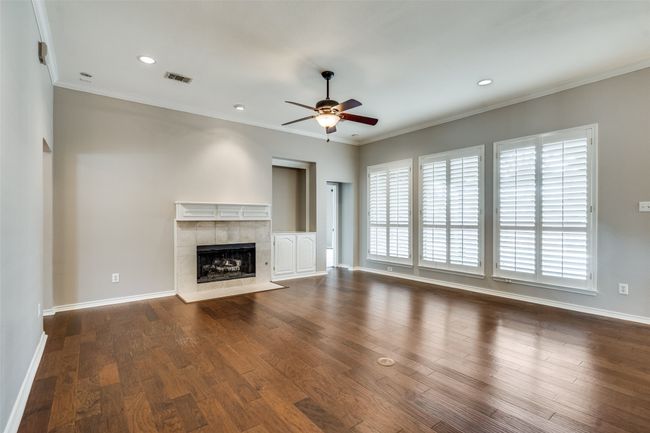 Large living room overlooks the covered patio and backyard. | Image 4