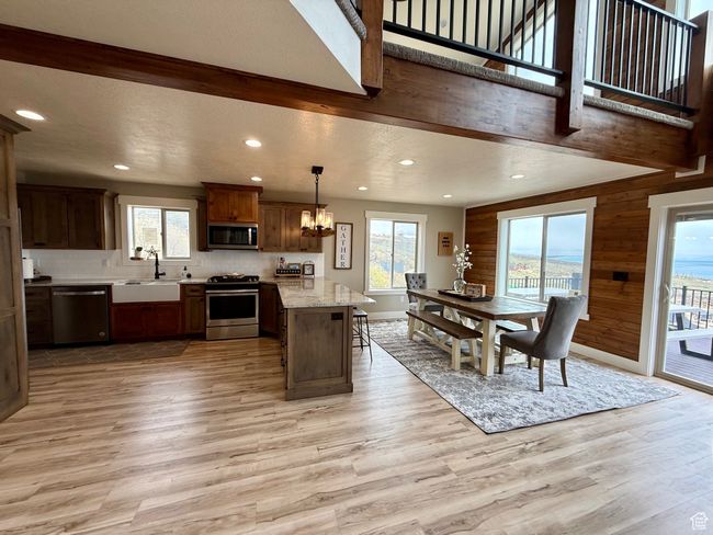 Kitchen featuring a sink, appliances with stainless steel finishes, light wood-style floors, and recessed lighting | Image 19