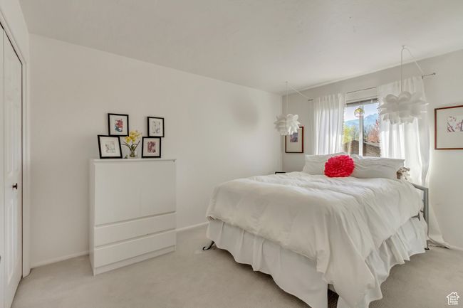 Bedroom with a closet and light carpet | Image 20