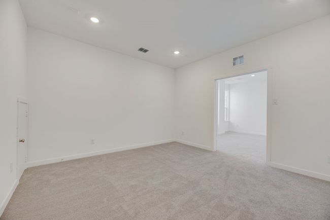 Empty room featuring light carpet and recessed lighting | Image 16