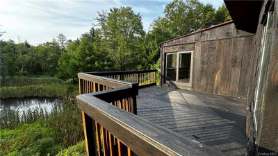 Wooden deck with a water view | Image 3