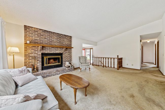 Main level living room with ample natural light. | Image 5