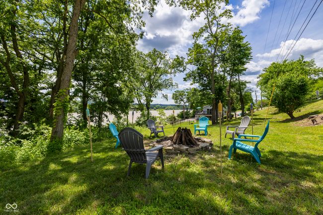 view of green lawn with a fire pit | Image 54