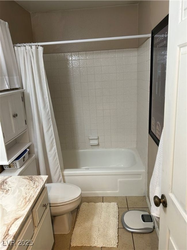 Full bath with vanity, shower / bath combo, and tile patterned flooring | Image 35