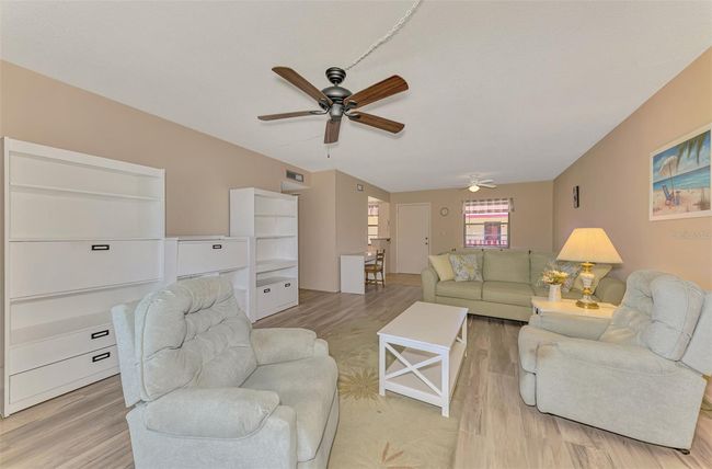 View from Living Room back towards Dining and Kitchen. | Image 16
