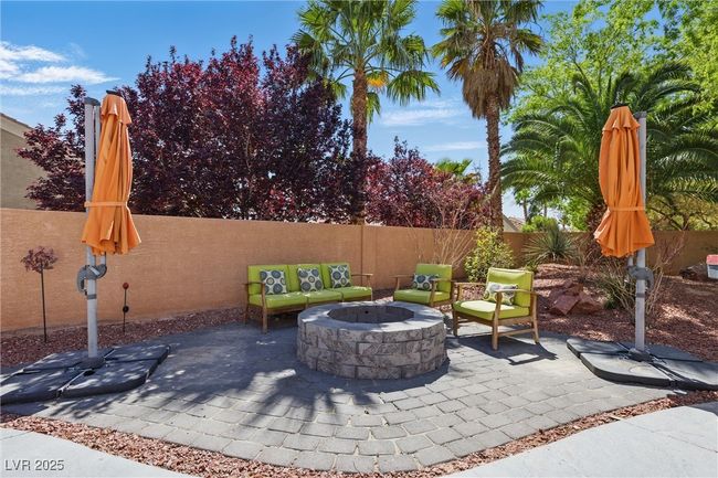 View of patio / terrace featuring a fenced backyard and an outdoor fire pit | Image 36