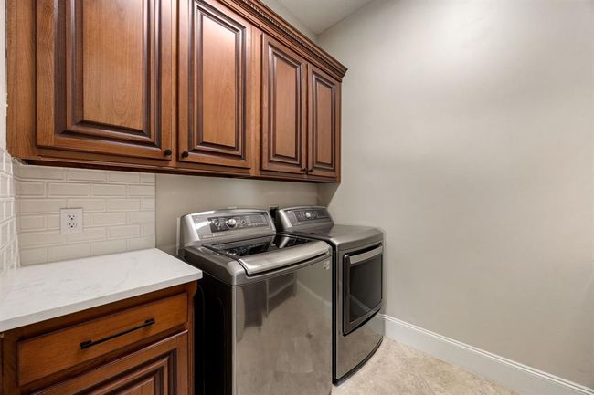 Laundry room with appliances that will stay with the home. | Image 25