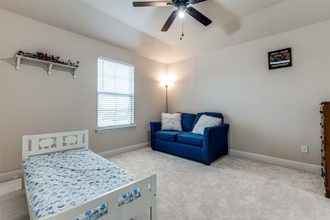 Bedroom featuring carpet flooring and ceiling fan | Image 18
