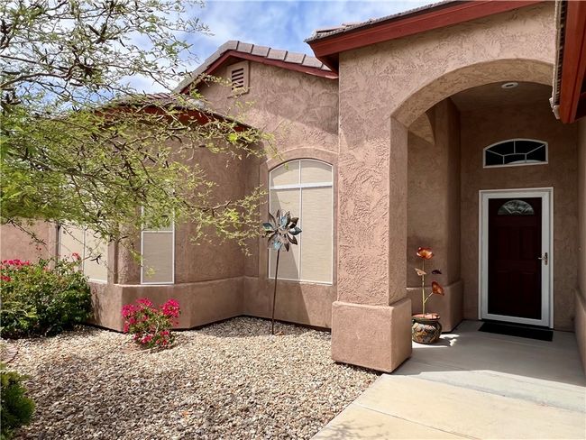 Entrance to property with stucco siding | Image 5
