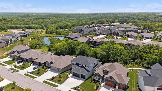 Aerial view of property's location featuring nearby suburban area and a nearby body of water | Image 40