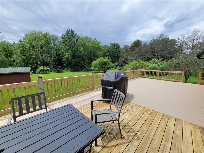 Deck with a lawn and grilling area | Image 22