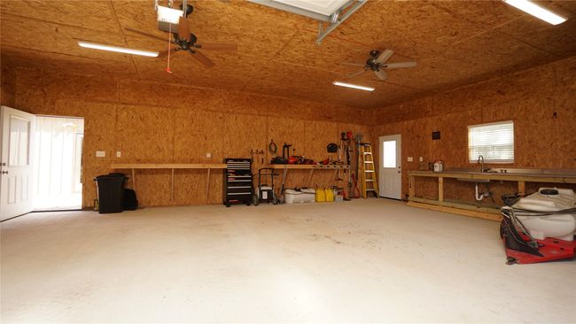 Electric garage door with opener for easy access, and how about ceiling fans when you are working or if you want to bring everyone outside | Image 24