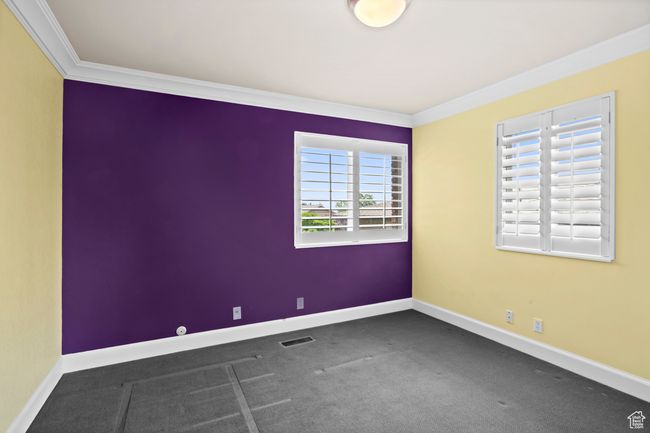 Carpeted empty room featuring crown molding | Image 26