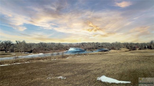 This part of the parcel would potentially make a great building spot for a home with riverfront views while you have your hay ground/livestock below. | Image 15