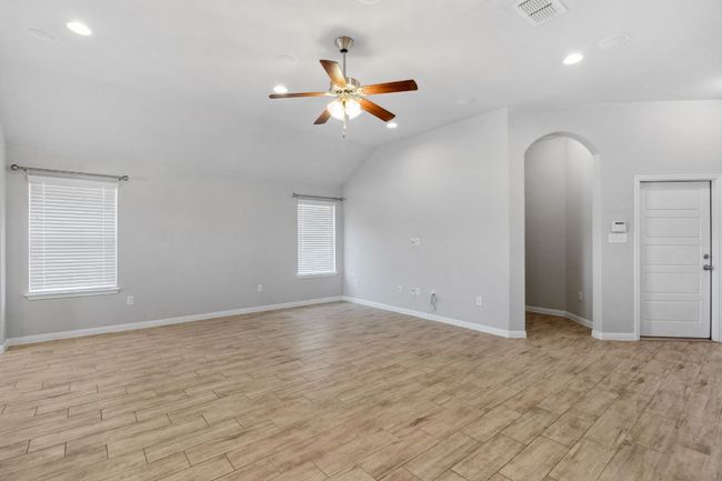View into living room with utility room and garage entry shown to the side | Image 9