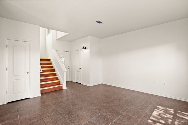 Unfurnished room with stairway and baseboards | Image 8