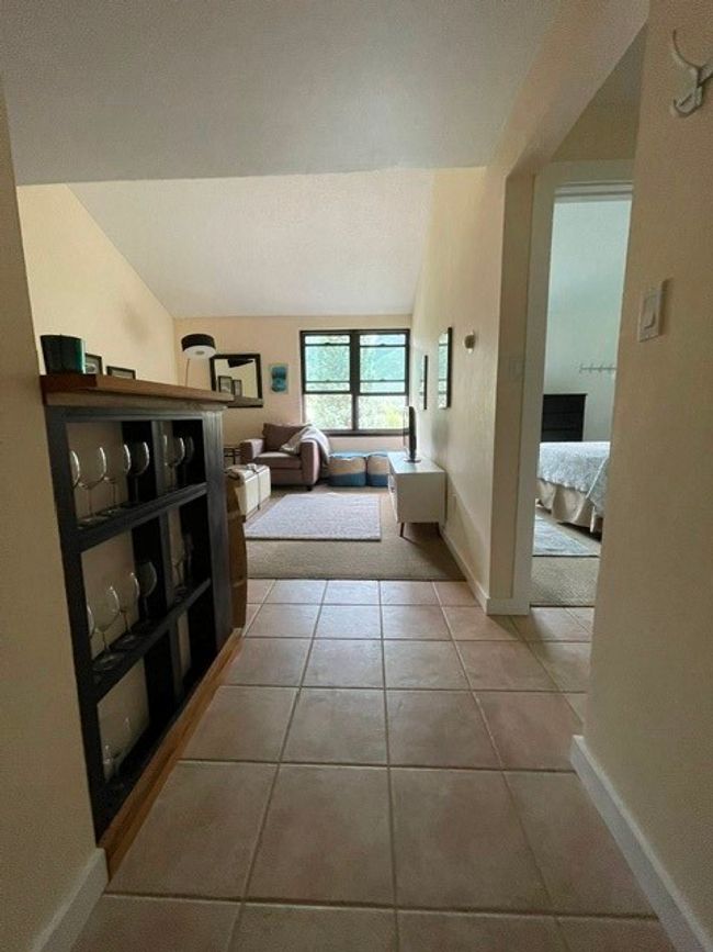 Tiled bedroom with baseboards | Image 20