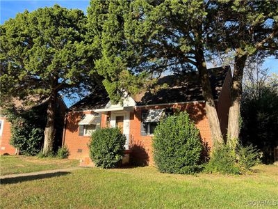 View of home's exterior with a lawn | Image 2